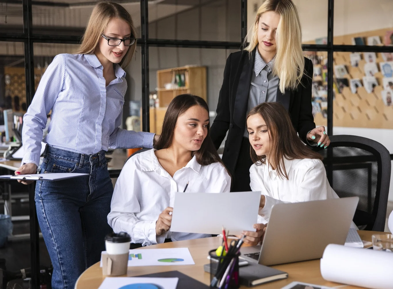 women work using electronic devices